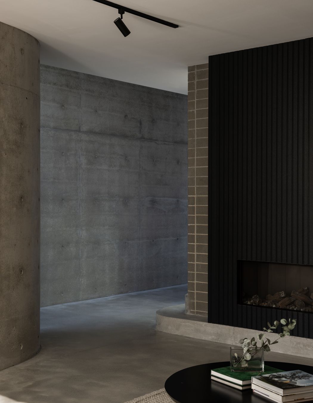 Monochromatic greys and robust materials line the downstairs.