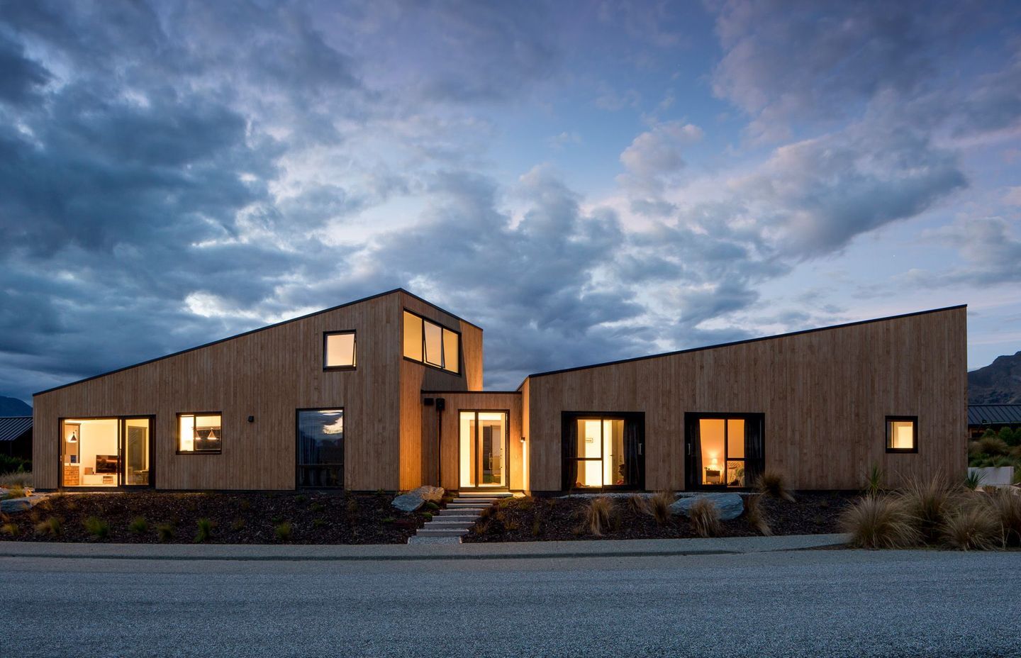 Two distinct pavilions create a form that a changes angle in response to the irregular site boundary,  providing a sheltered yet sunny outdoor living area.