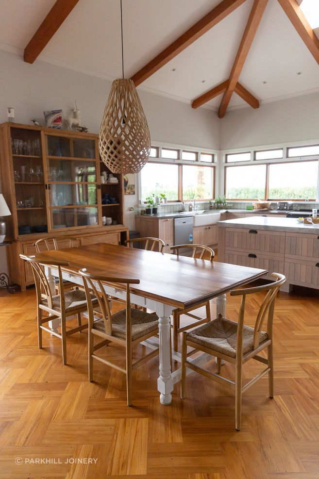 The oak parquet floor contrasts the custom timber cabinetry.