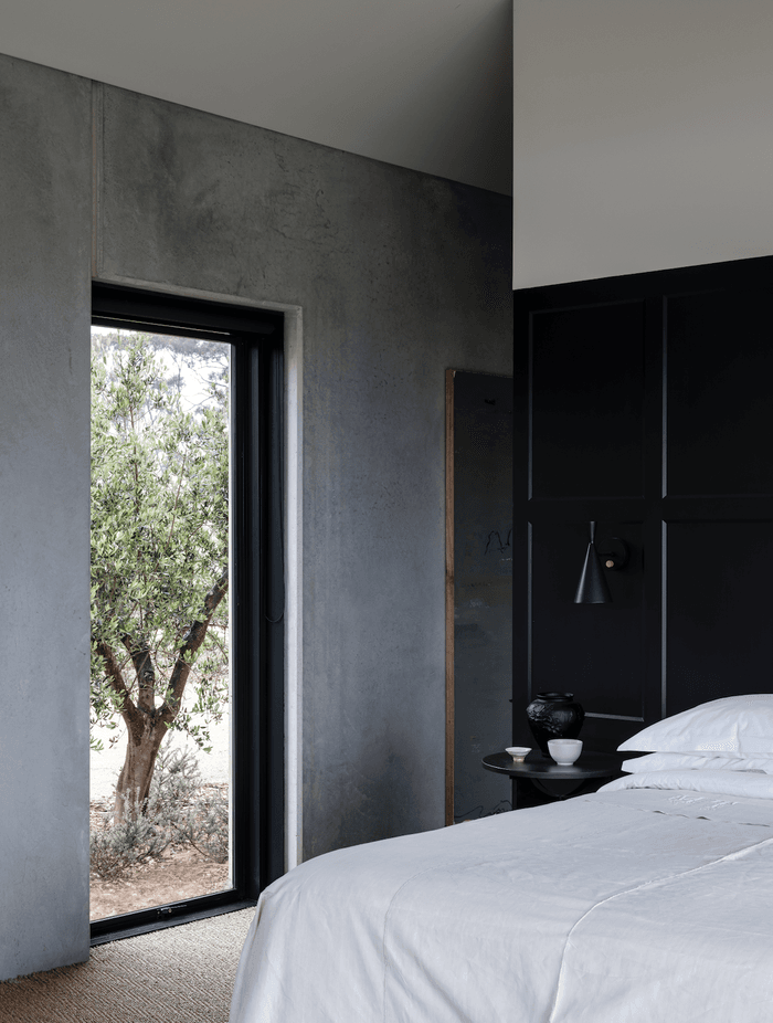 “The monastic simplicity of concrete panels has lent the interiors a rawness that tends towards the serene," describes Moloney.