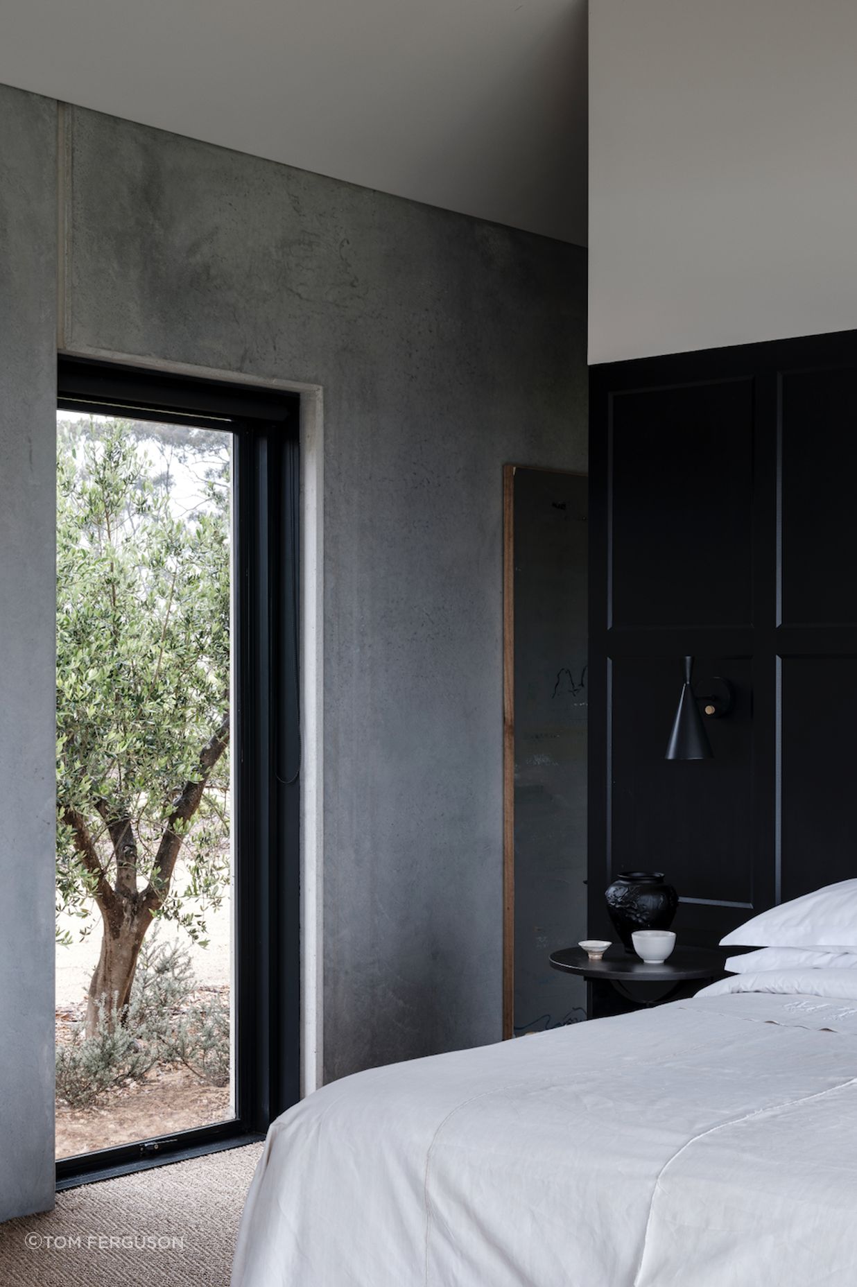 “The monastic simplicity of concrete panels has lent the interiors a rawness that tends towards the serene," describes Moloney.