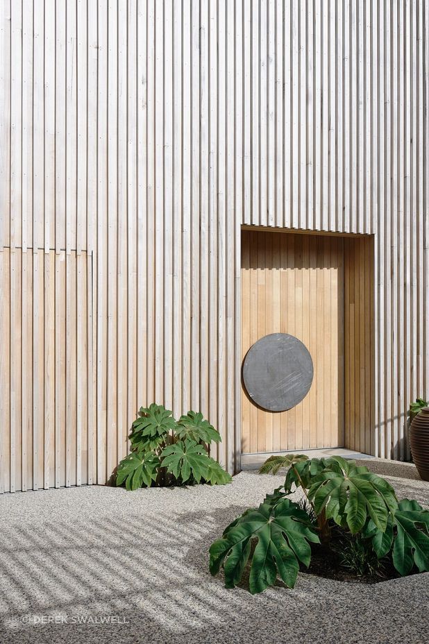 The raw coastal exterior is clad entirely in iron ash.