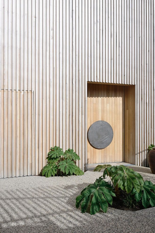 The raw coastal exterior is clad entirely in iron ash.