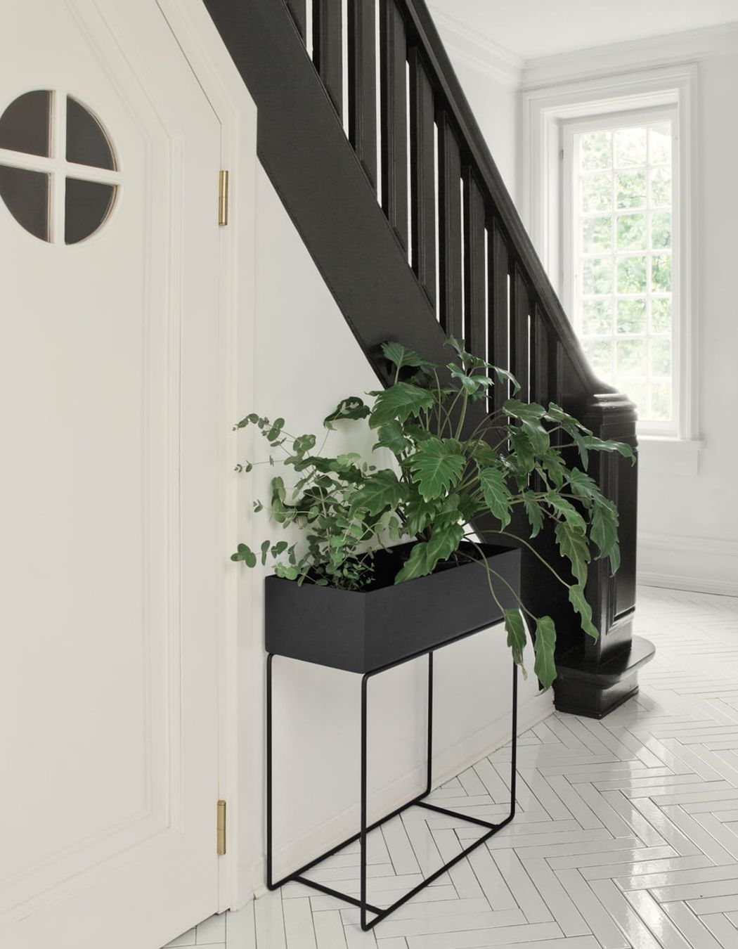 With planter boxes like this black steel model from SLOW, nature can easily be brought inside. 