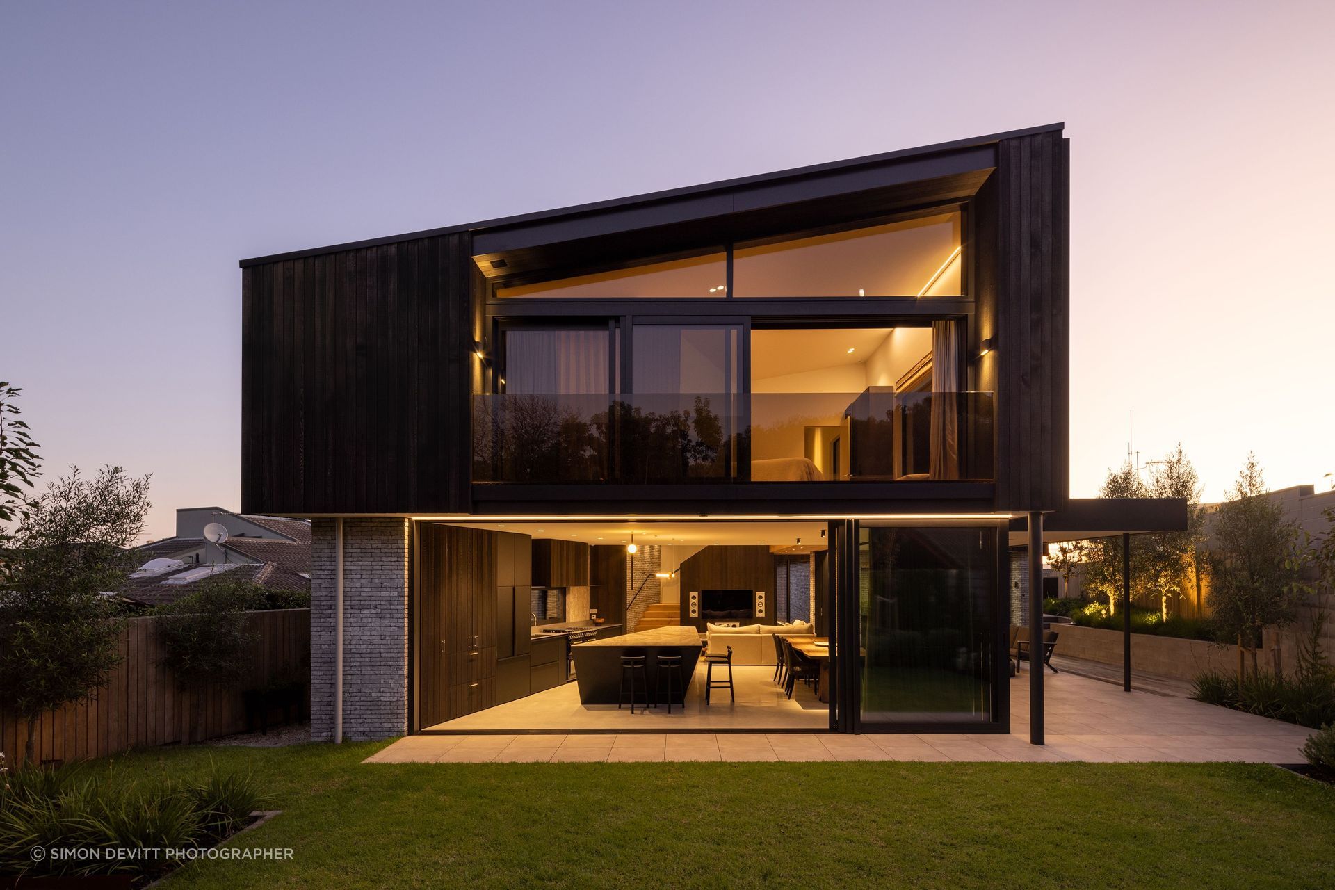 Pitau's sculptural frame bathed in evening light.
