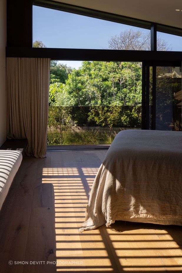 Natural linens work with timber in the 'Master Retreat'