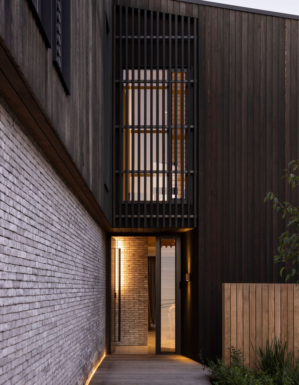 Custom cedar cladding and bricks work in harmony