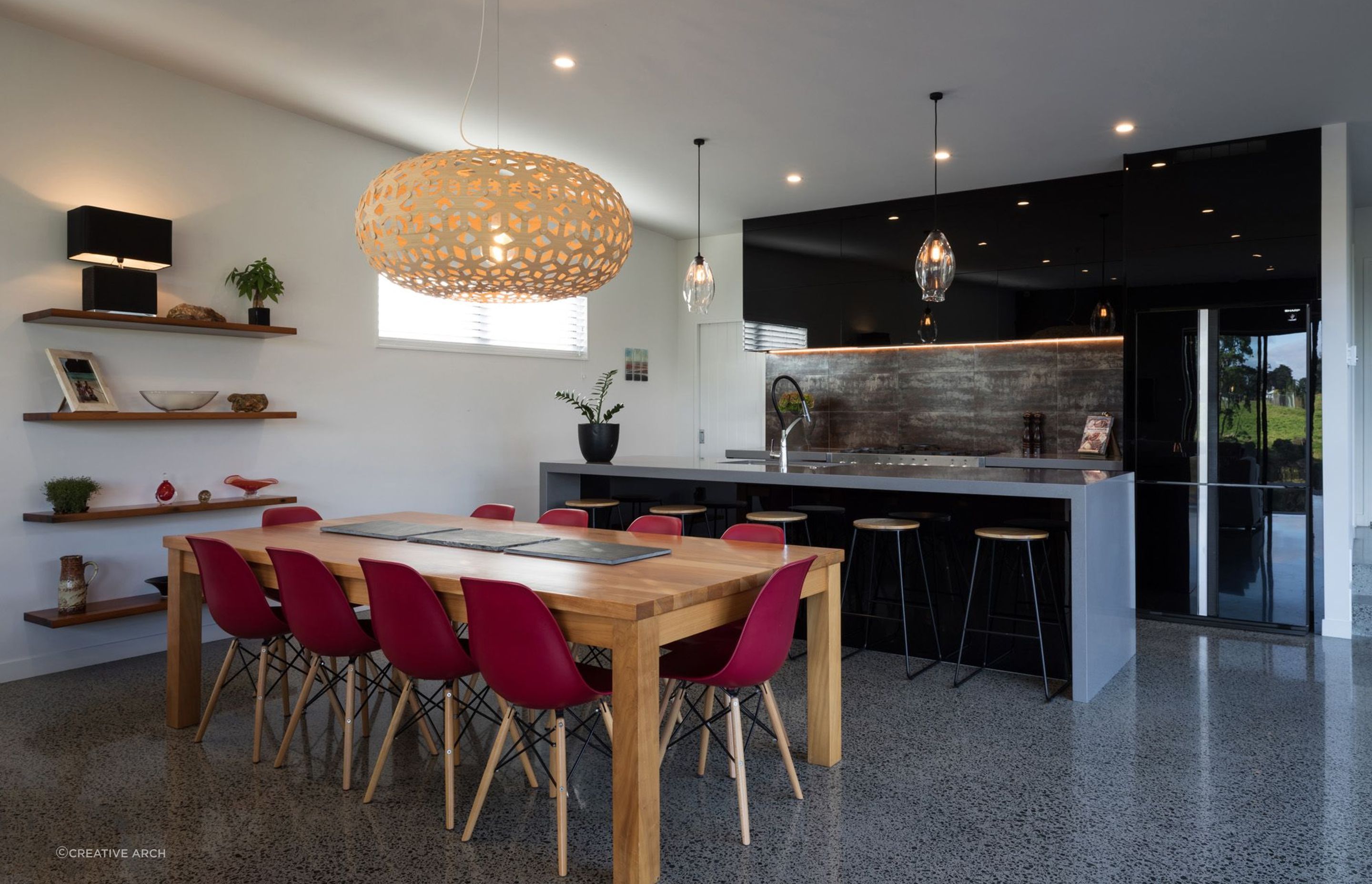 A concrete slab and polished floors with high thermal mass help the home absorb energy from the sun. Photo: Mark Scowen.