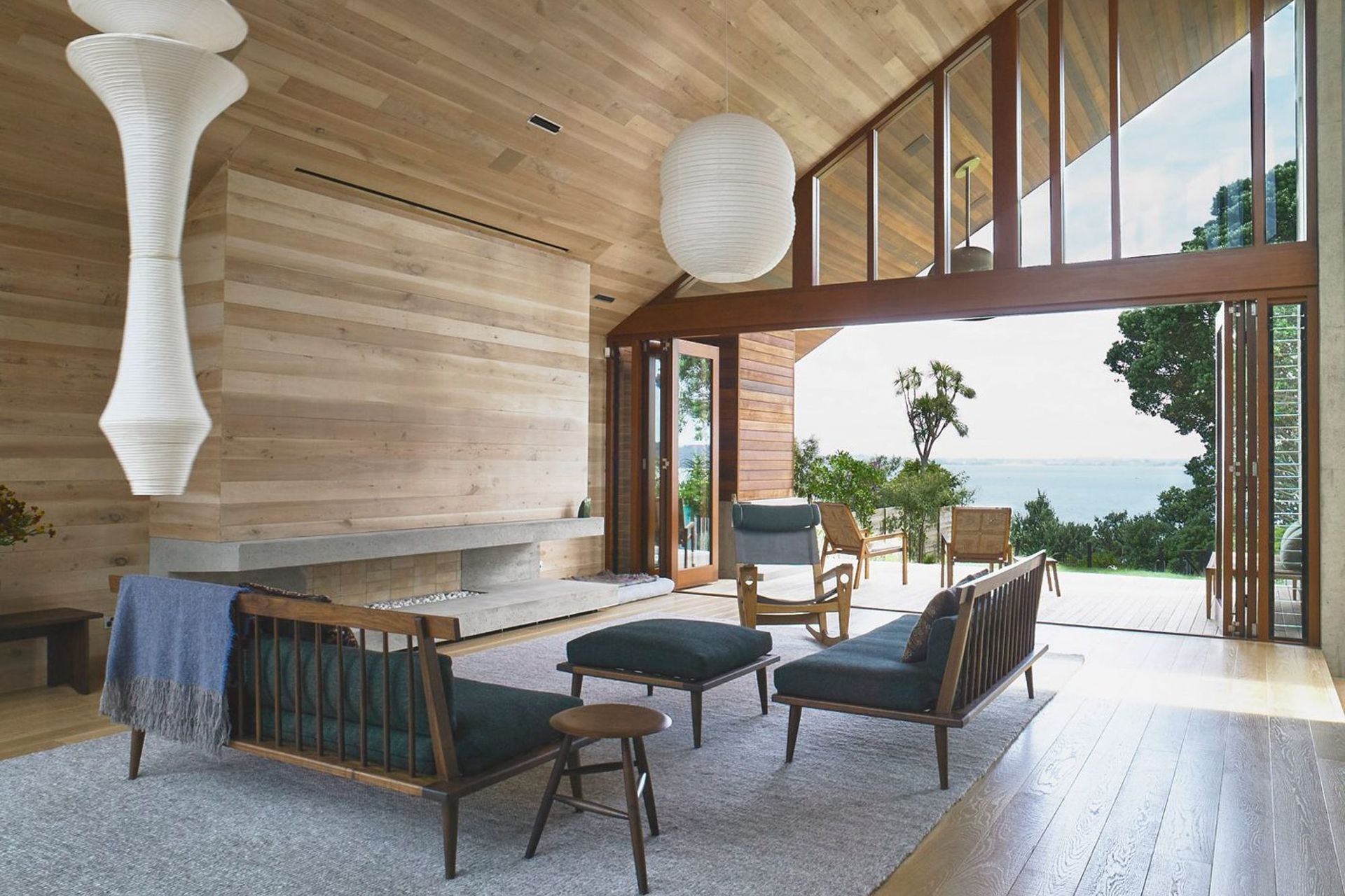 At Rawene House by Stevens Lawson Architects, timber-panelled walls merge into ceilings and floors, creating beautiful warm and flowing spaces―a peaceful haven in the city. Photograph by Mark Smith.