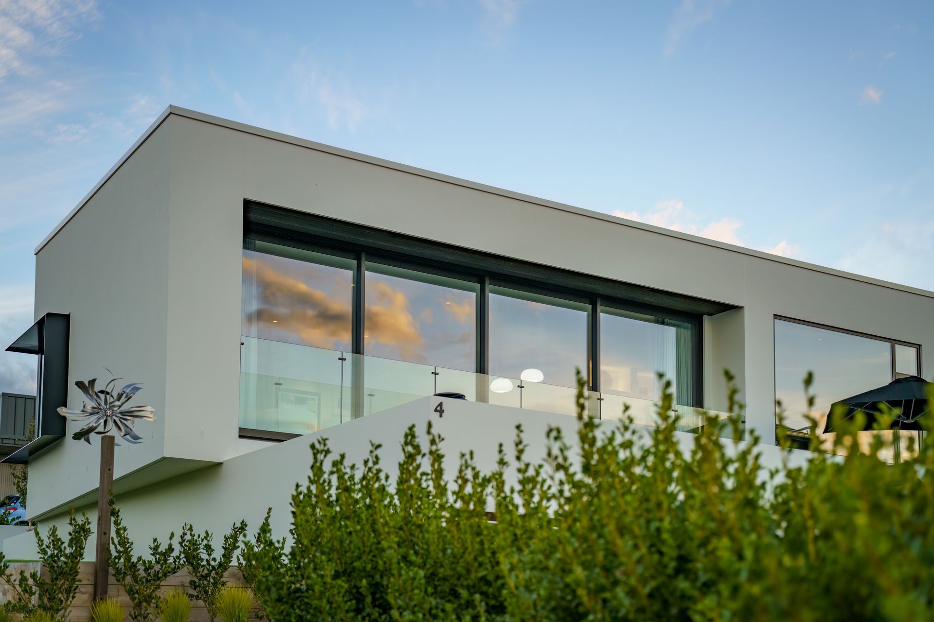 The cantilevered level of the home draws an interesting frame