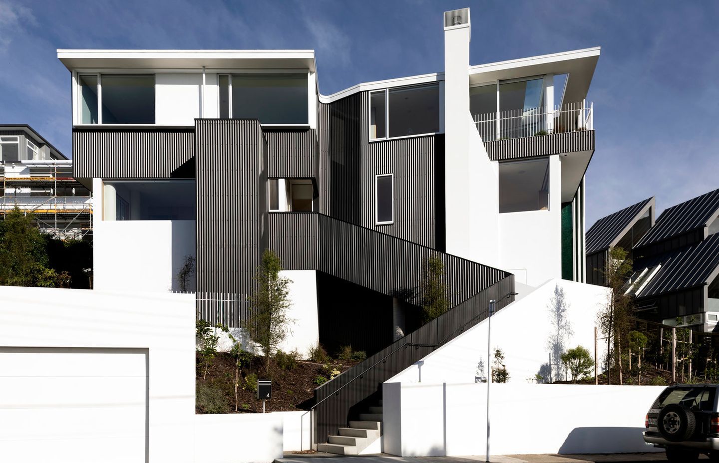 Parsonson Architects' Salmont Place project is a very modern renovation that utilises the existing concrete structure of a two-storeyed 1950s house and transforms it into two cleverly laid-out apartments overlooking Wellington harbour. Photograph by David