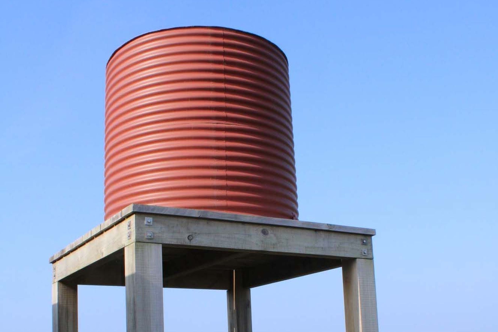 Water tanks, like this stainless steel model from Tanksalot, can provide all the water storage needed off-grid.