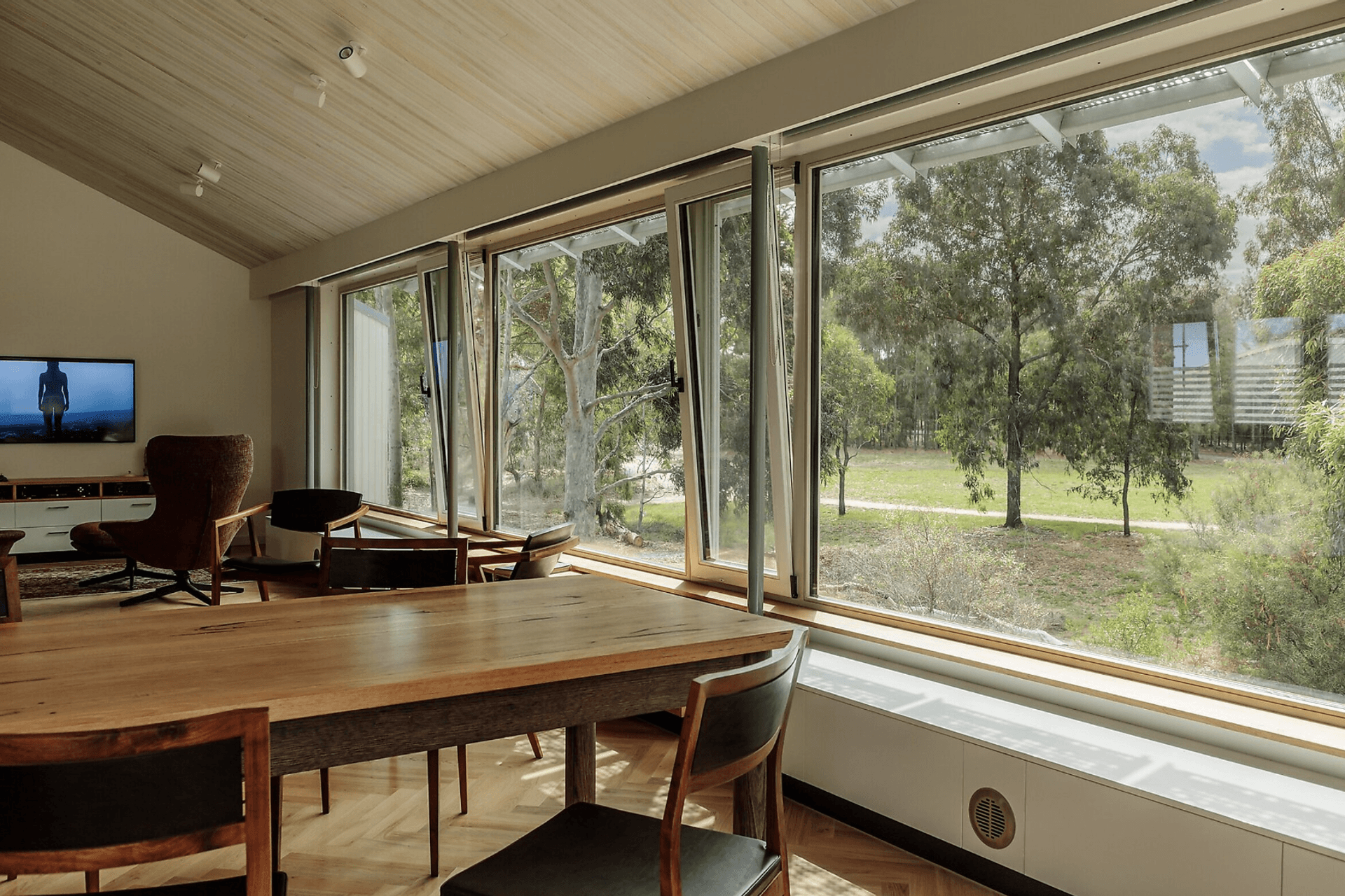 Pine ceilings add a textural element, while strategically placed lighting imbues a comfortable and inviting ambience, particularly during the night.