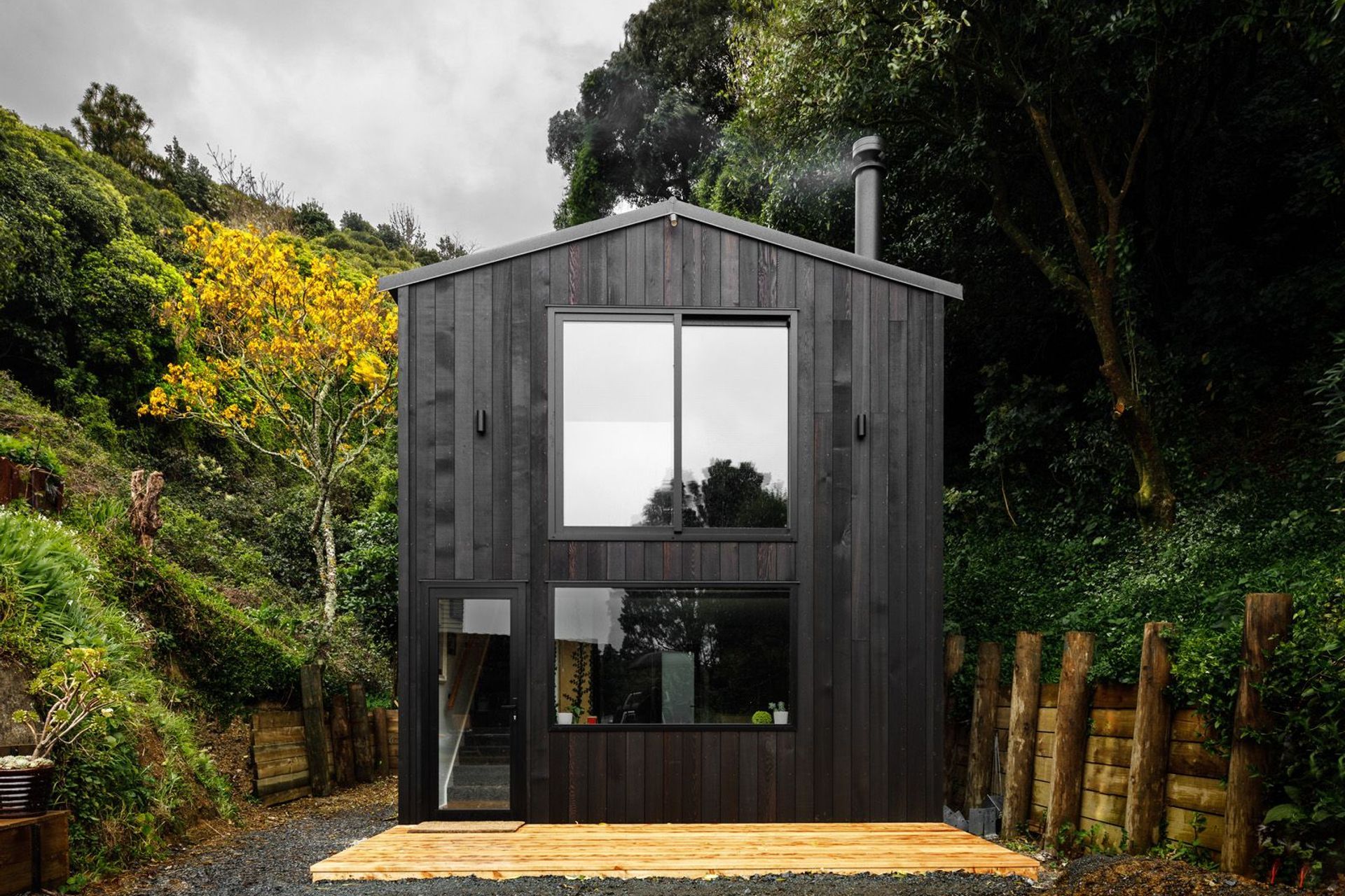 The bold and stylish dark timber exterior of the Vogeltown Tiny Home by Inline Design & Build