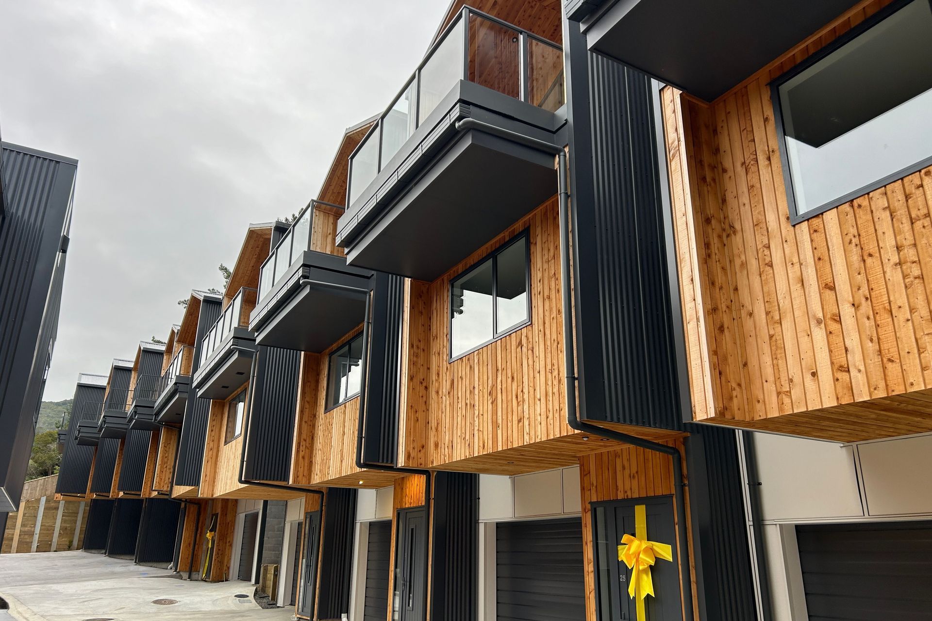 Extensive use of MacDirect's macrocarpa timber softens the exterior façade.