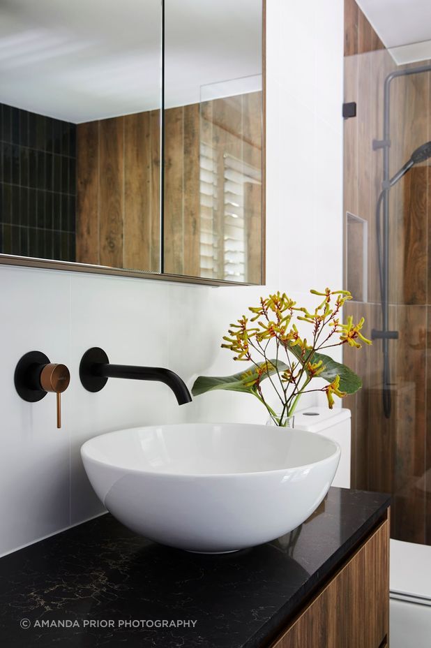 Black fittings and bench top add drama to the space.