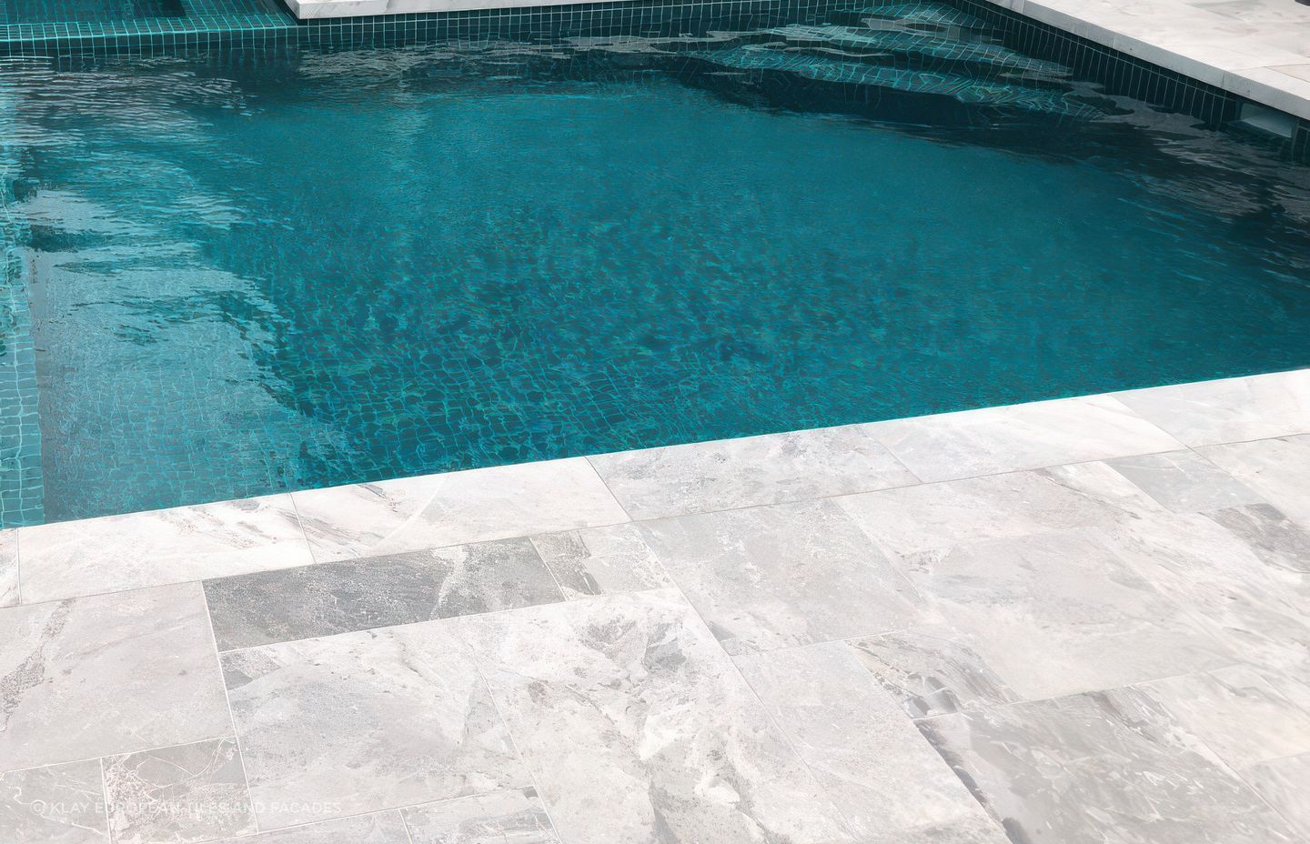 Marble in French Pattern paving with Jade Green 48×48 Pool Tile. Pool by Hamill Pools