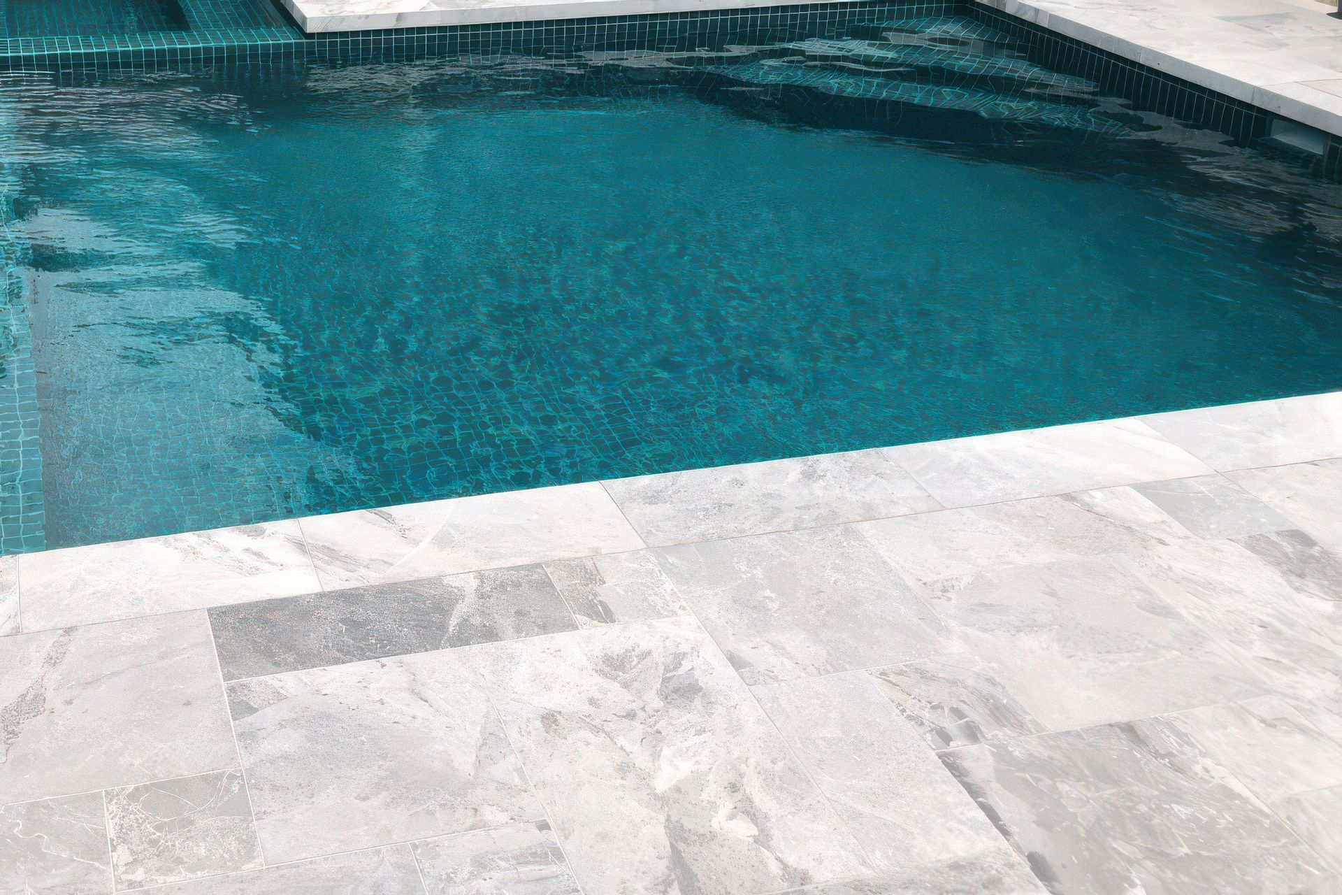 Marble in French Pattern paving with Jade Green 48×48 Pool Tile. Pool by Hamill Pools