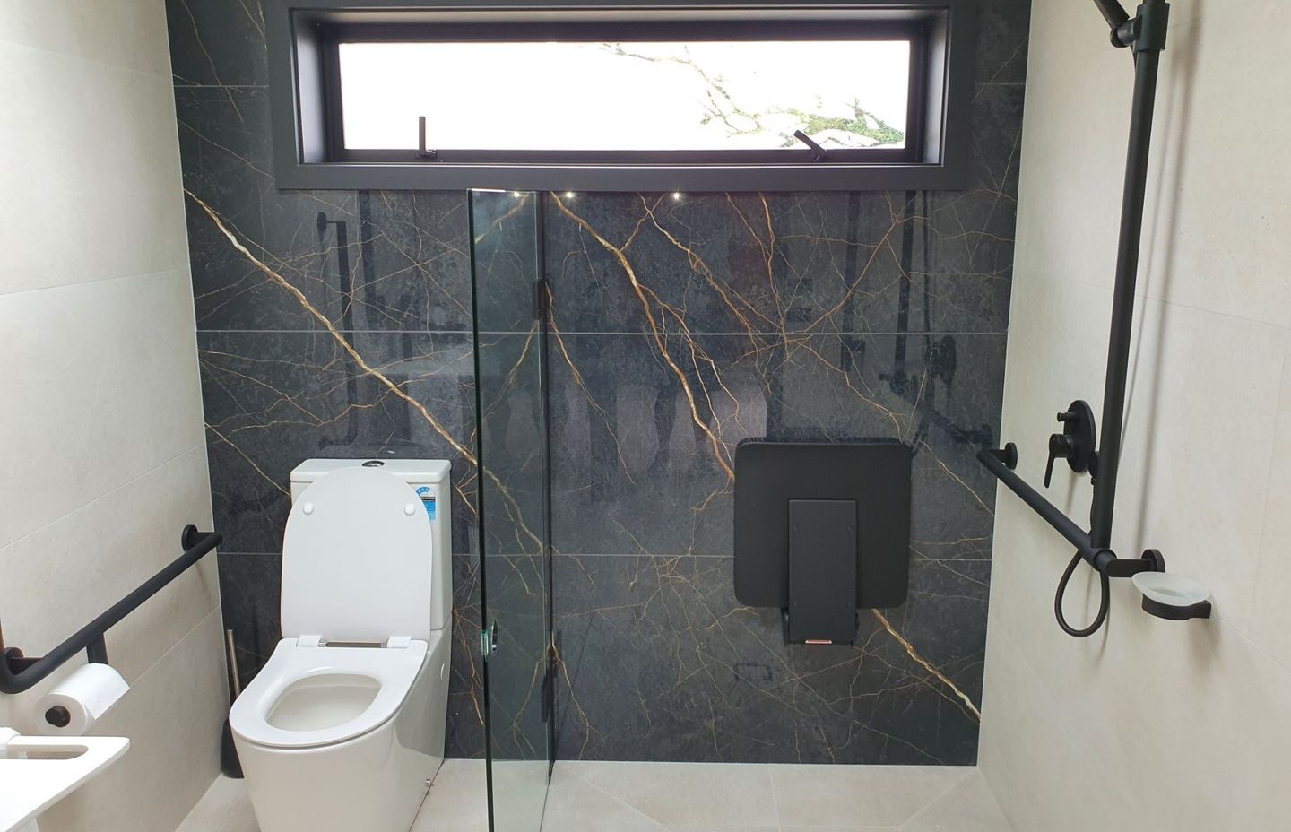 Grab rails should be easily-accessible from a shower seat.