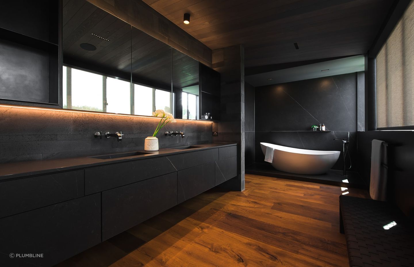 Controlled lighting allows you to set the mood with style with no shortage of it in this sublime bathroom in a Parnell home