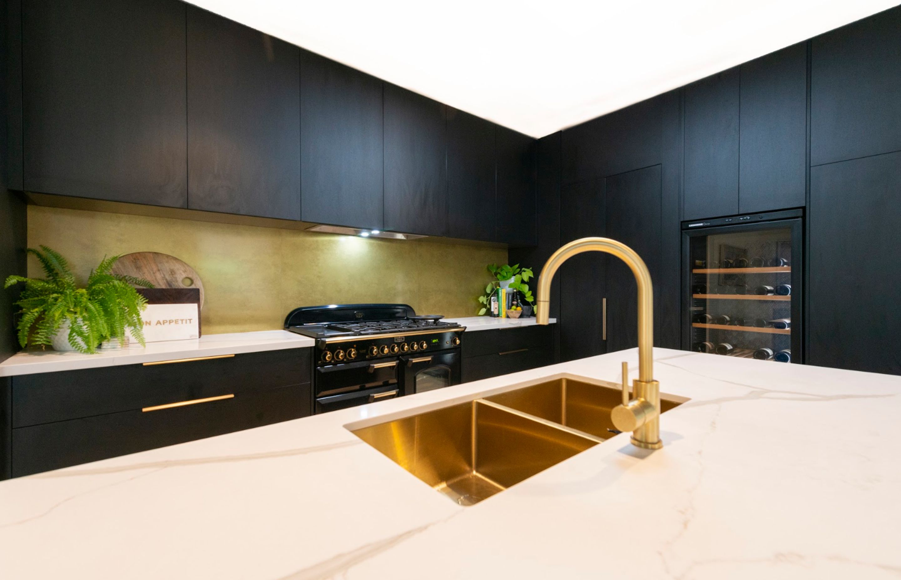 A popular way to incorporate metal surfaces is on kitchen splashbacks.