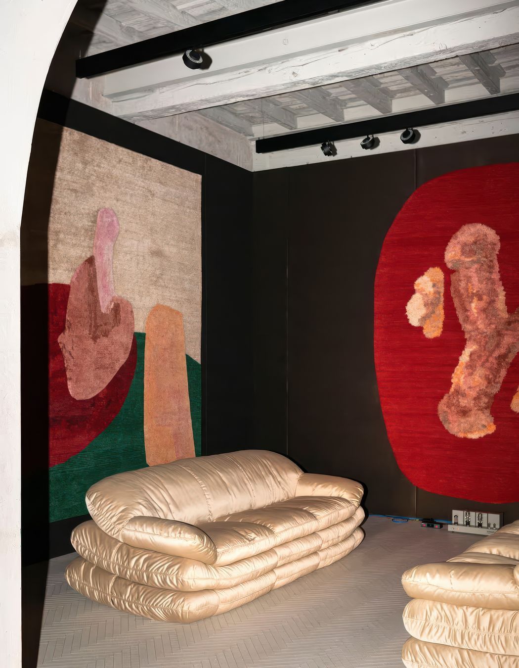 Spare Parts and Poking Fun Rugs with furniture by Tacchini
