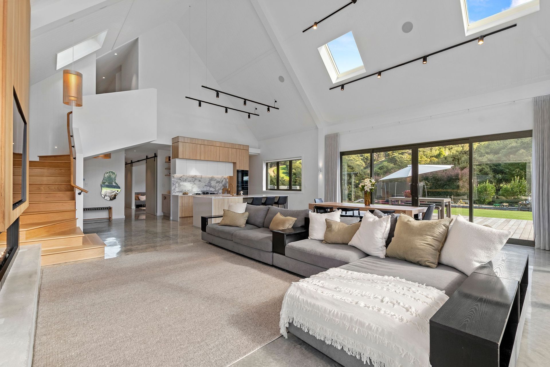 The timber stairs lead from the living area into the more private 'family zone' upstairs.