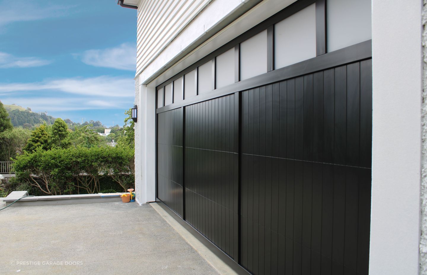 “Garages that are used as home gyms or offices benefit from windows; consider a full plexiglass door or adding windows to another garage door style.”