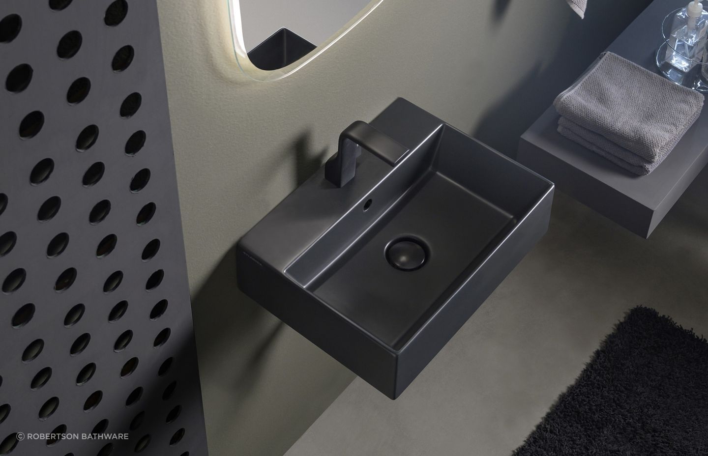 The App light vessel basin, seen here in a carbone finish, works in both residential and commercial settings.