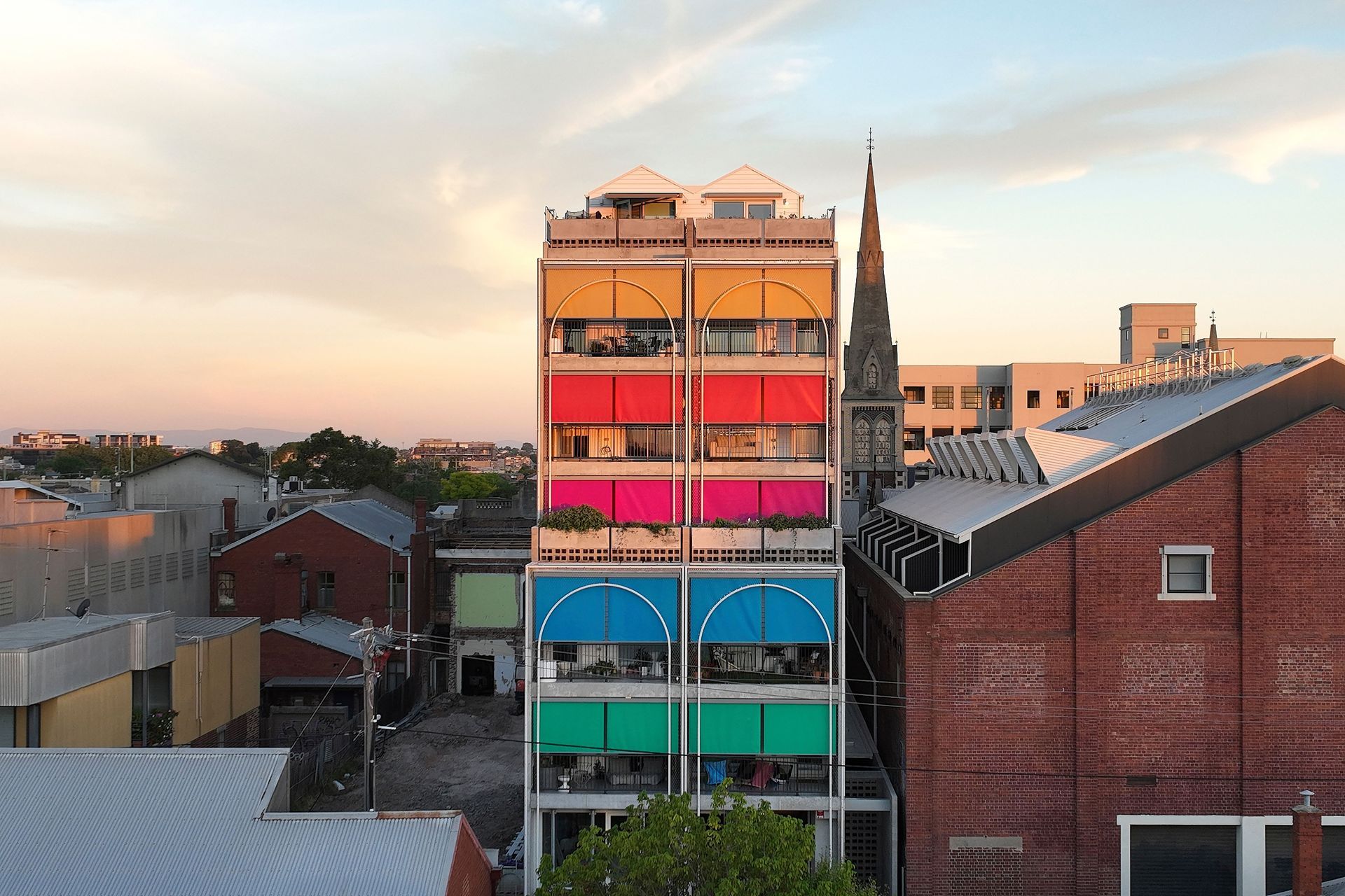 The playful colours selected for the sun shading on this multi-residential project give it personality and character.