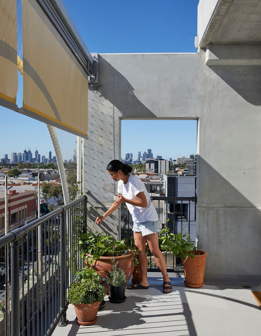 A resident is able to control shading from her terrace.