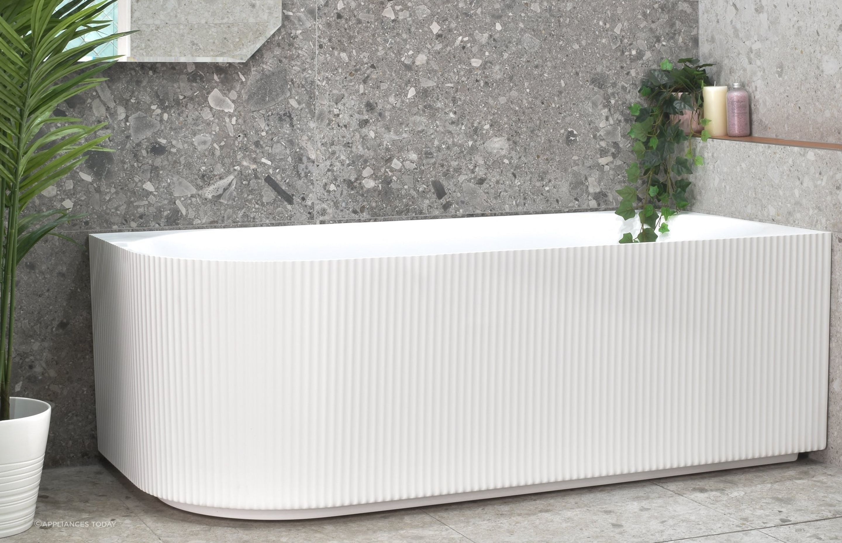 The uniqiue fluted design of the Brighton Groove Fluted Oval Freestanding Right Corner Bath injects texture and depth in a space.