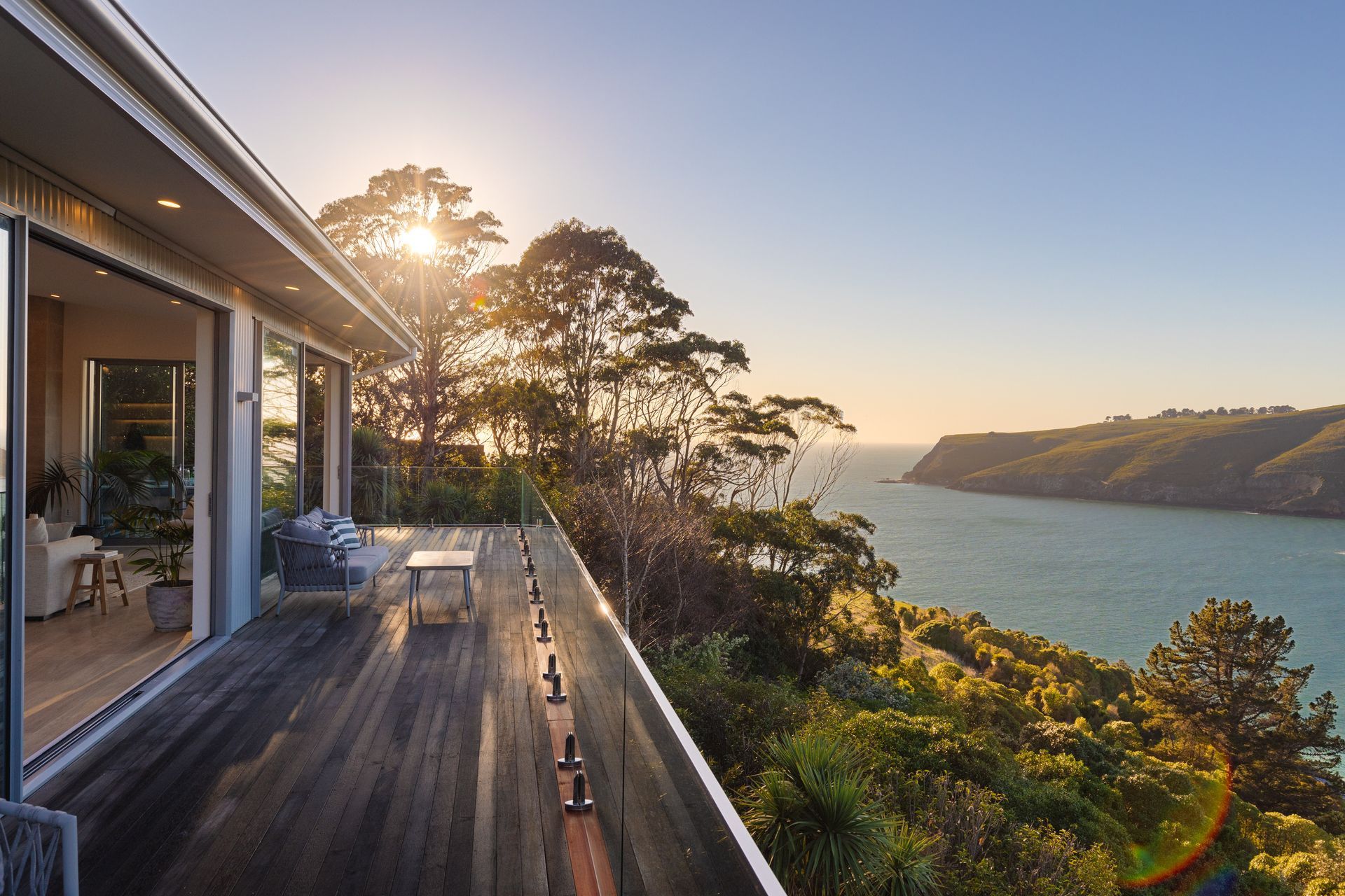 Glass balustrades, like these stylish options by NZ Frameless Glass are an excellent choice for coastal locations.