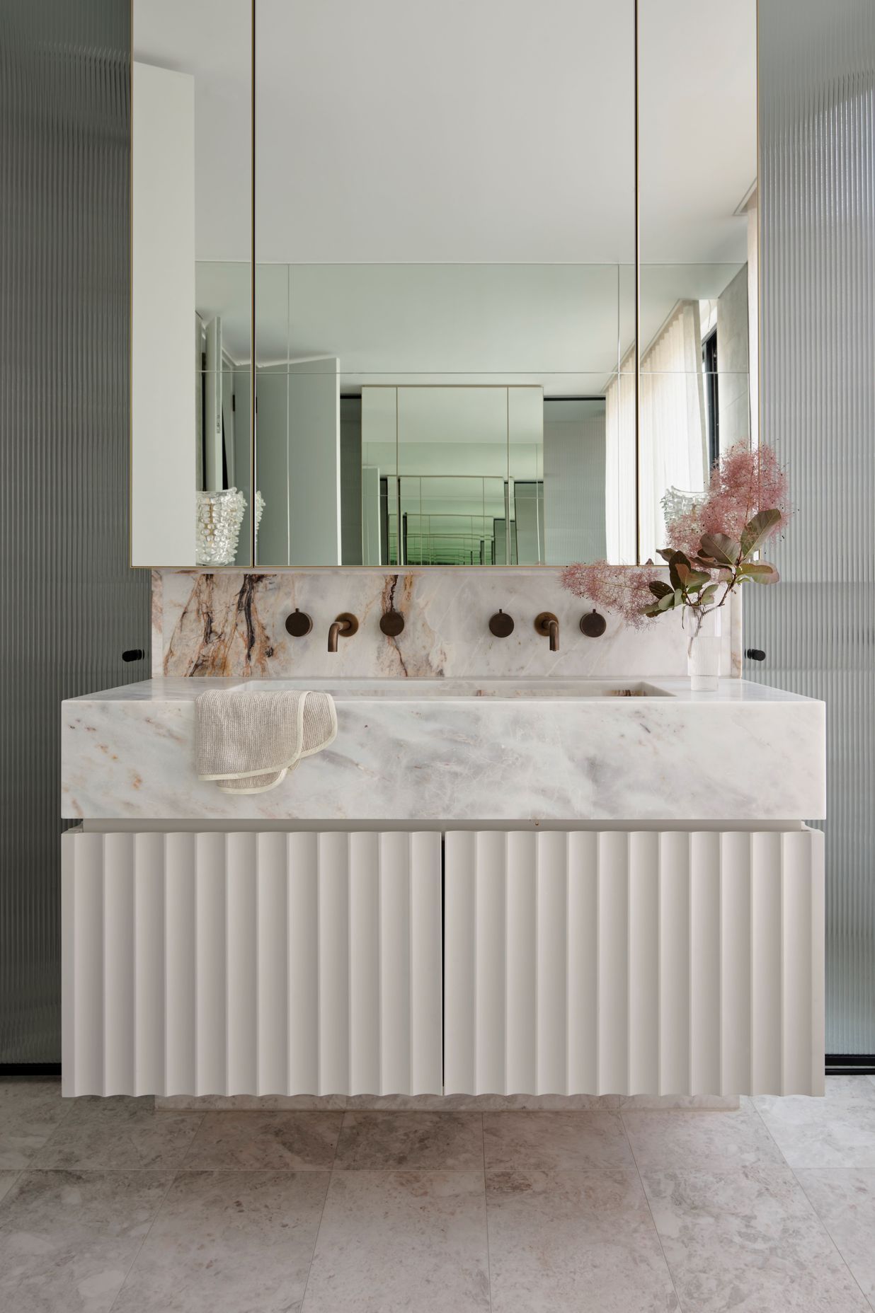 Skheme's Palladian marble features on the counter top and their Epoca Blush tiles are displayed on the floor.
