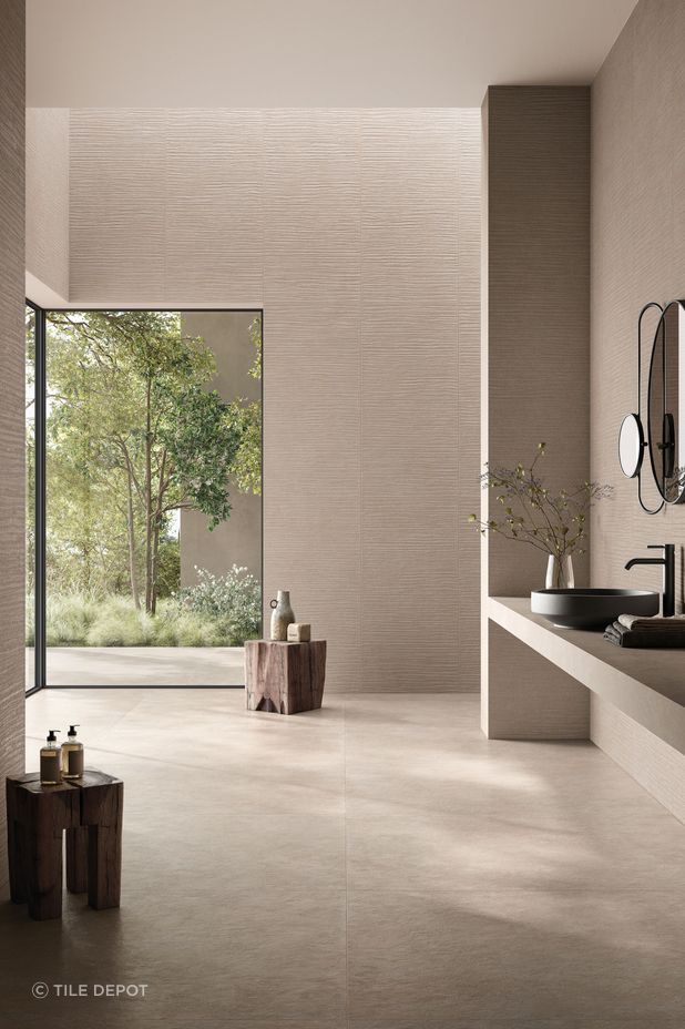 This bathroom has a handmade feel and features the Cement Vibes in Fango from The Tile Depot.