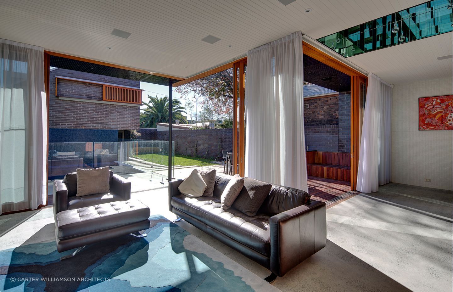 Tasteful furnishings and decor choices make this personal space welcoming for all - Photography: Brett Boardman