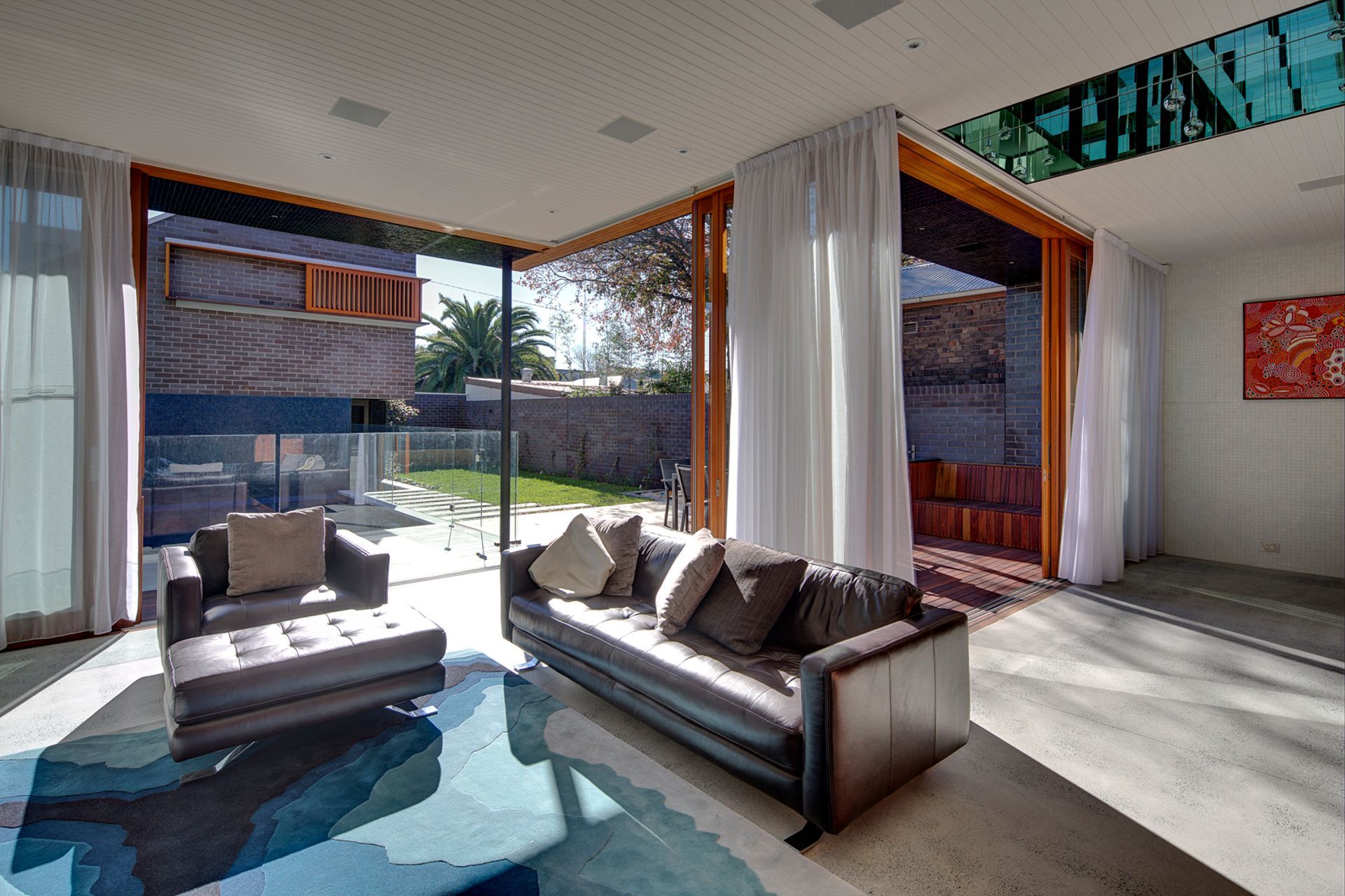 Tasteful furnishings and decor choices make this personal space welcoming for all - Photography: Brett Boardman