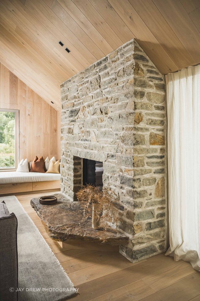 The Natural Stone Co.’s Cluden schist hearth demonstrates the quiet strength of bespoke stonework, where a functional element becomes part of the home’s architectural character.