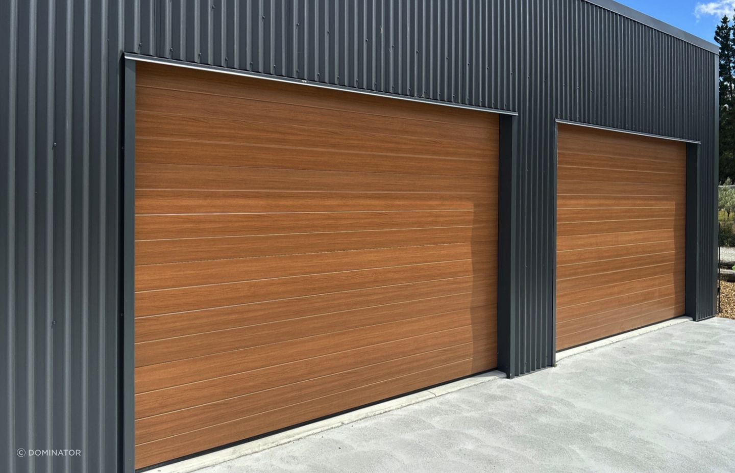 Dominator NatureSteel garage doors are the perfect combination of beauty and strength. NatureSteel material mimics the look of natural timber, giving your garage a sophisticated finish that will elevate the overall aesthetic of your property.