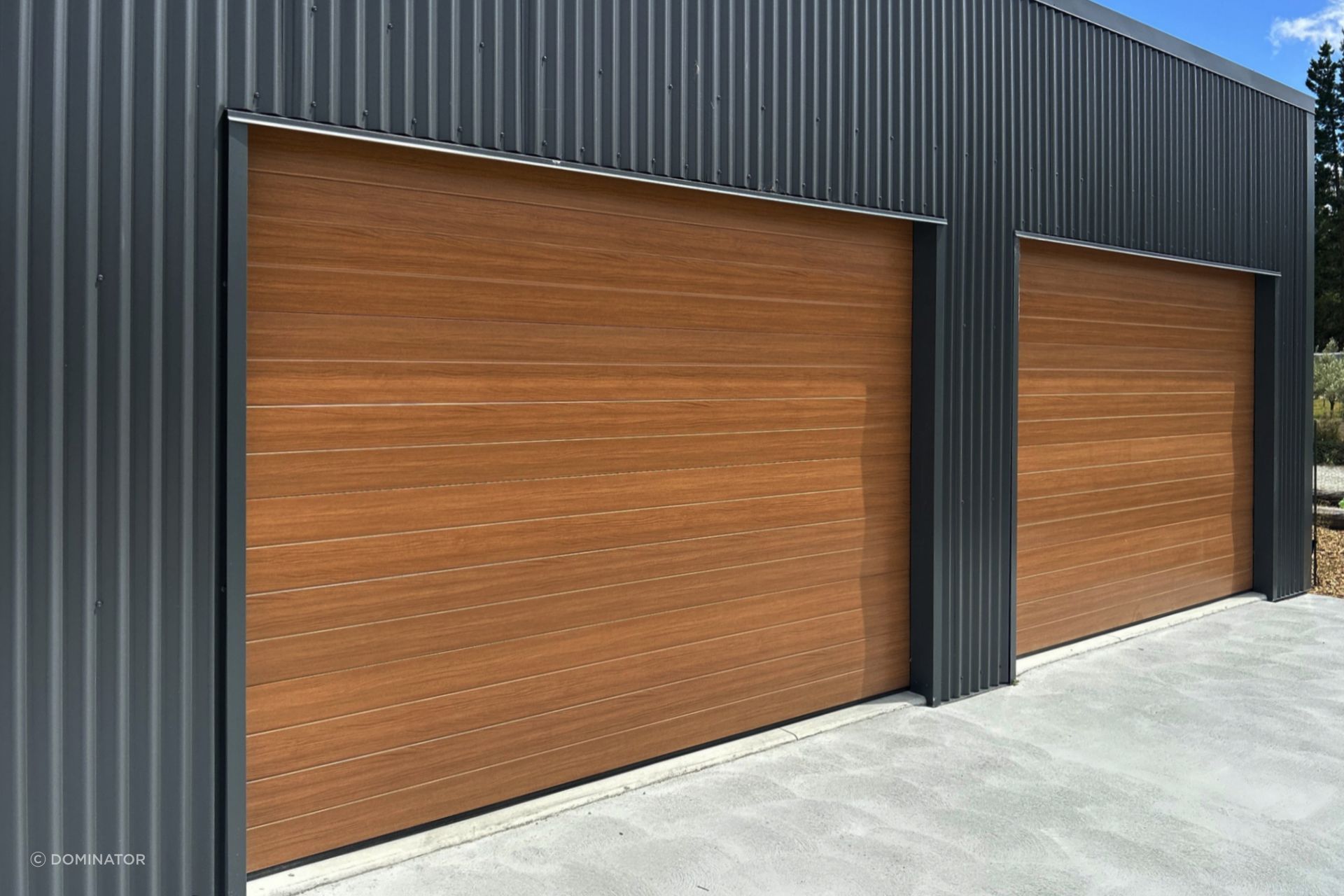 Dominator NatureSteel garage doors are the perfect combination of beauty and strength. NatureSteel material mimics the look of natural timber, giving your garage a sophisticated finish that will elevate the overall aesthetic of your property.