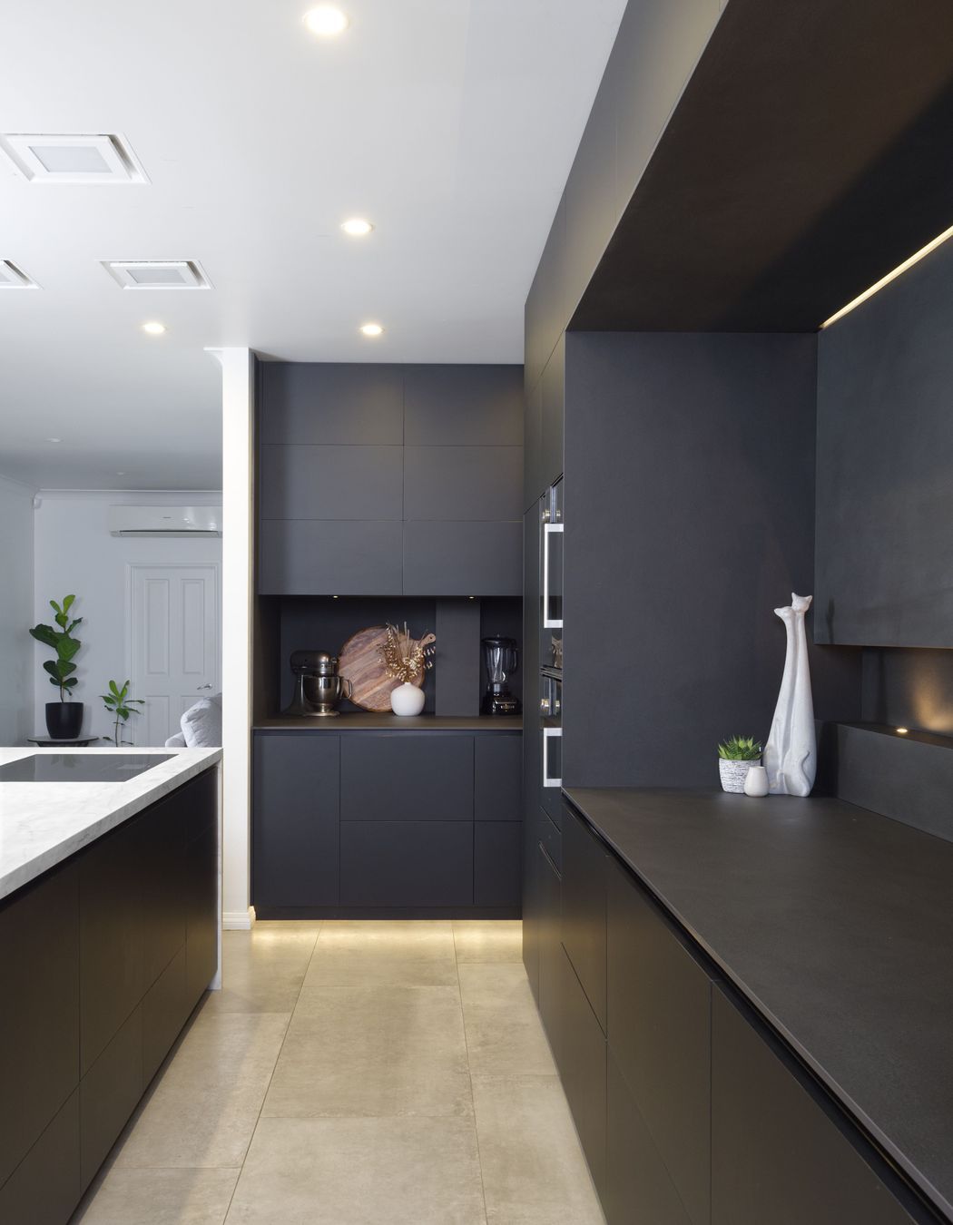 Matte black cabinetry adds a sophisticated feel.