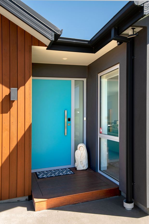 A single panel composite door becomes a feature in bright turquoise blue.