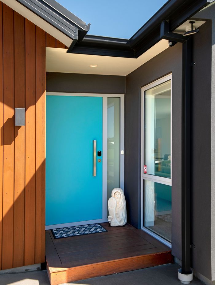 A single panel composite door becomes a feature in bright turquoise blue.