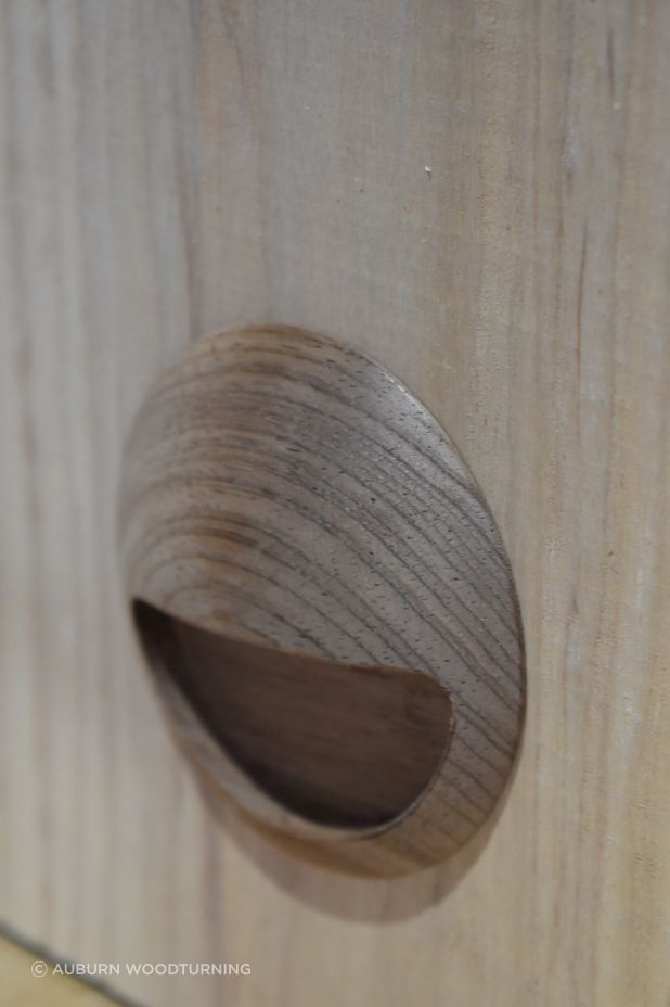 The inset pull are a recessed handle fixed within a mortised cavity that allows fingertips to pull the door outward