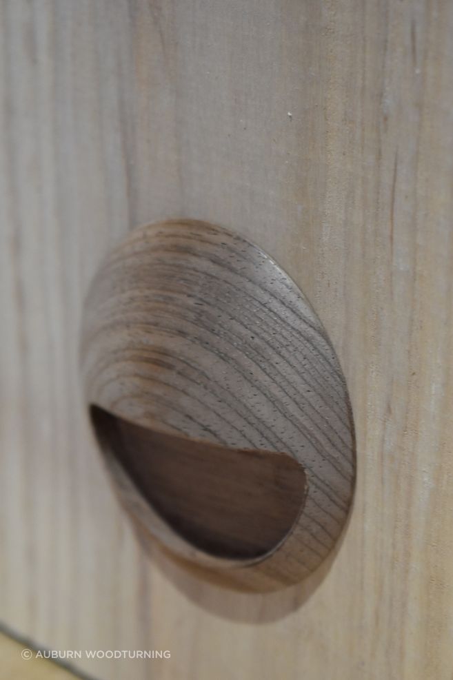 The inset pull are a recessed handle fixed within a mortised cavity that allows fingertips to pull the door outward