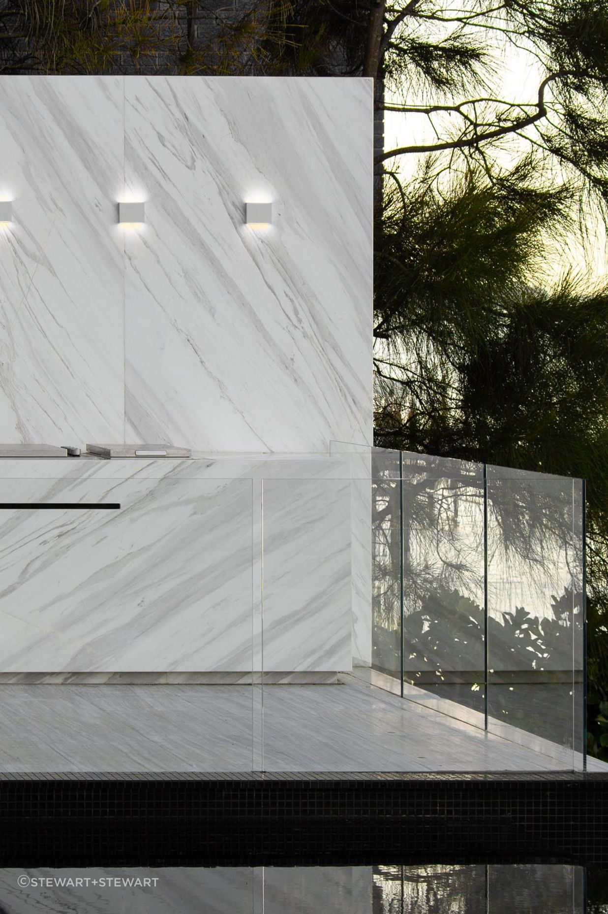 Marble lines the Ingot outdoor kitchen beside the pool.