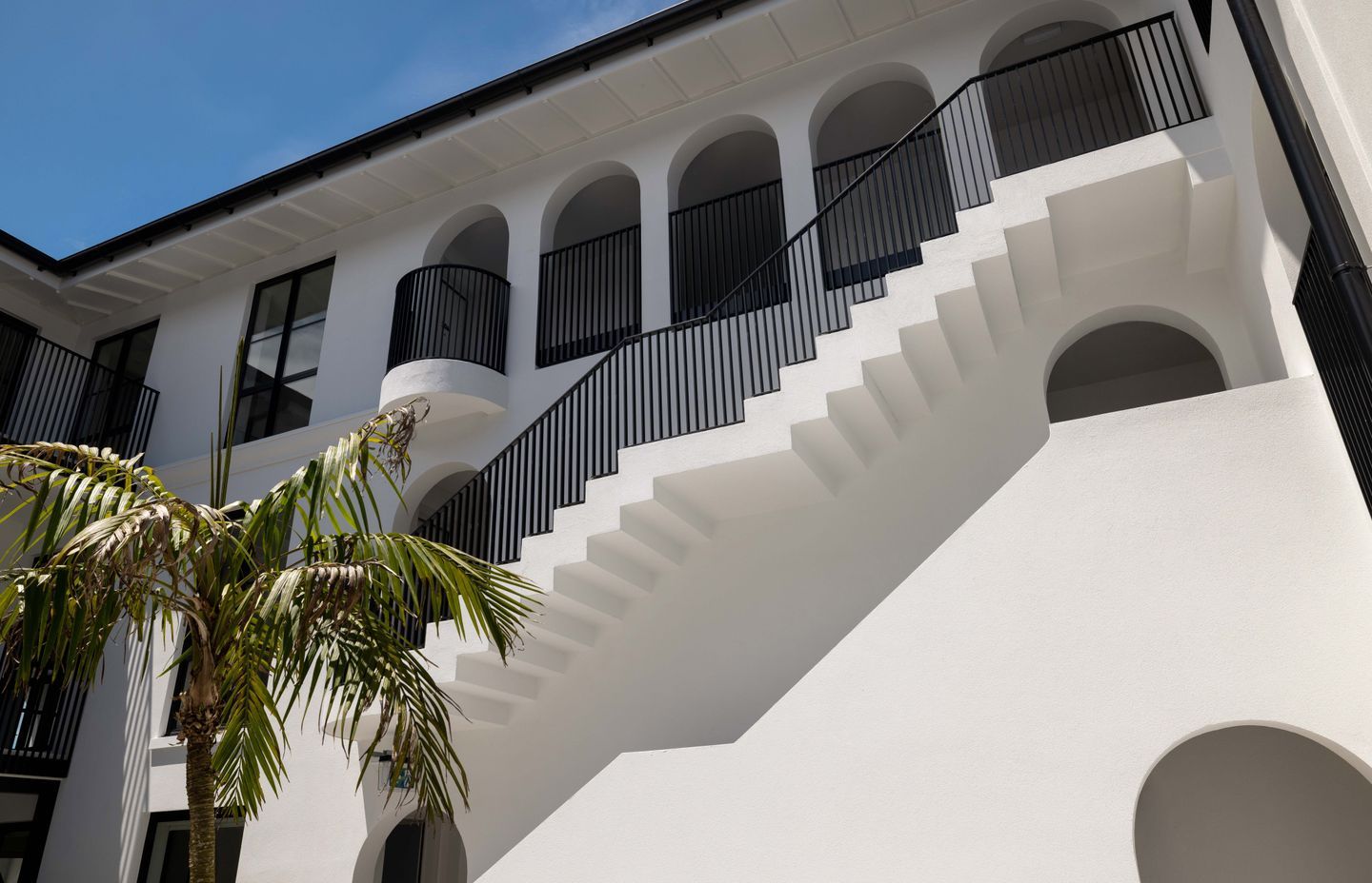A stairwell protruding into the courtyard.