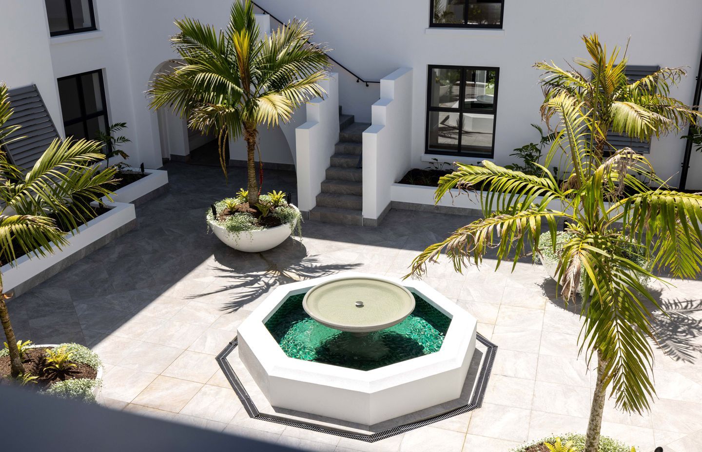 An integral part of the overall design, the courtyard was conceived with inspiration from California architecture.