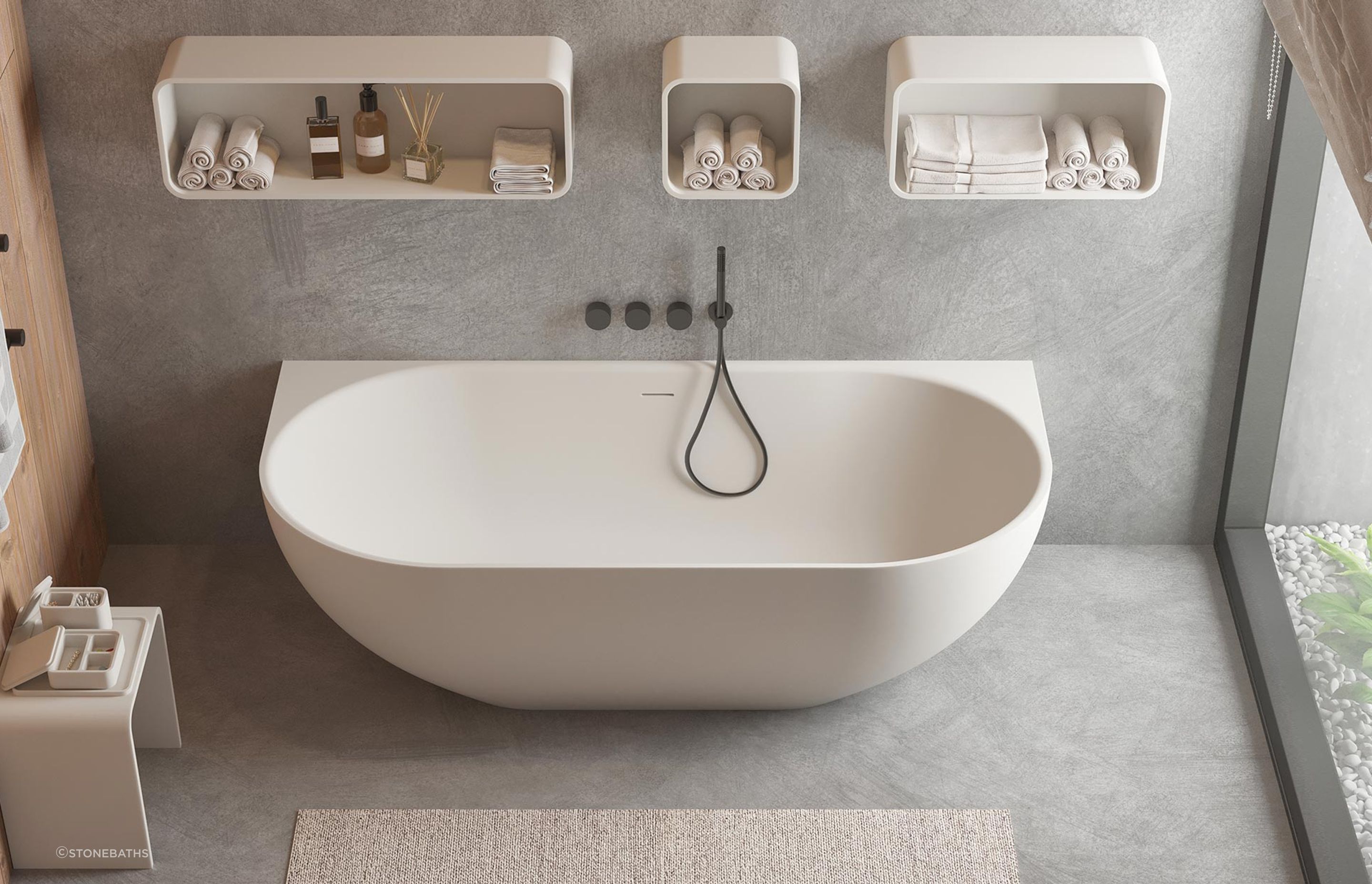 The Justina Back-to-Wall Stone Bath captures a beautiful, contemporary aesthetic and is easy to clean and maintain too.
