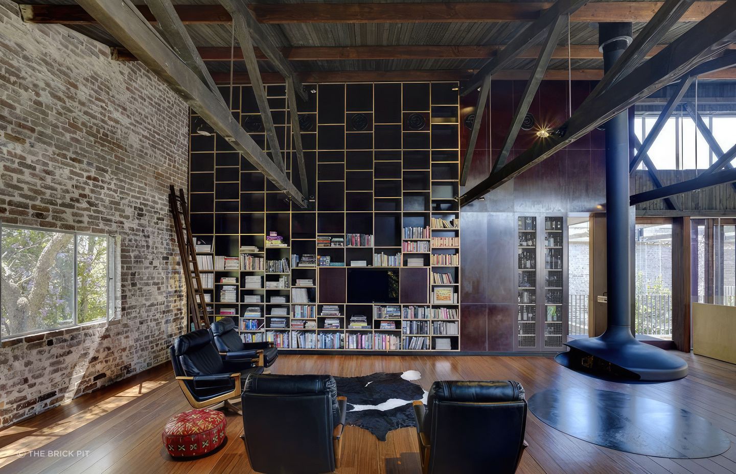 In this warehouse conversion, recycled bricks are a feature that grounds the home.